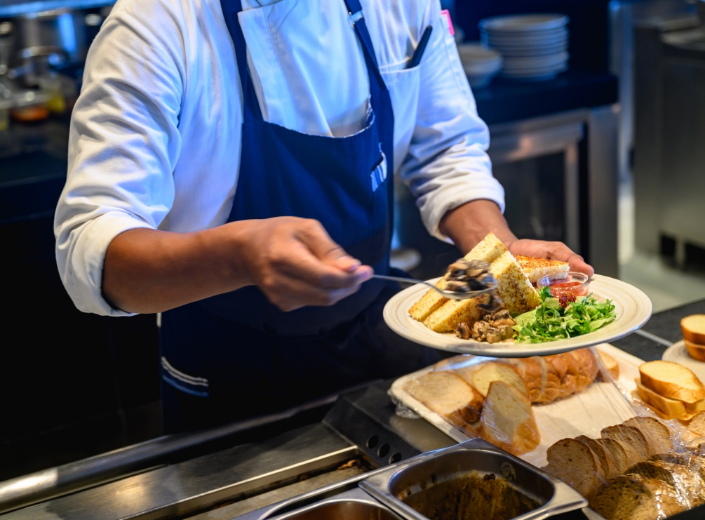 Cafeteria worker serving food